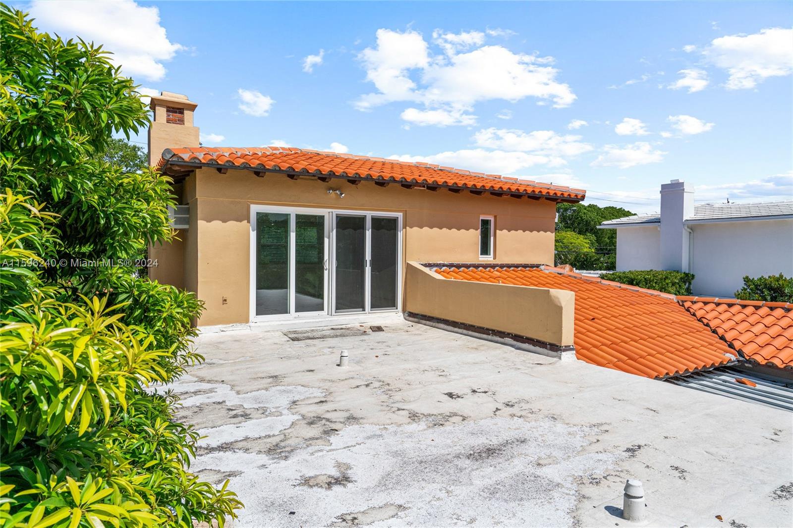 5311 Alton Road Miami Beach, FL 33140 - Photo 50 of 51 a front view of a house with a yard and garage