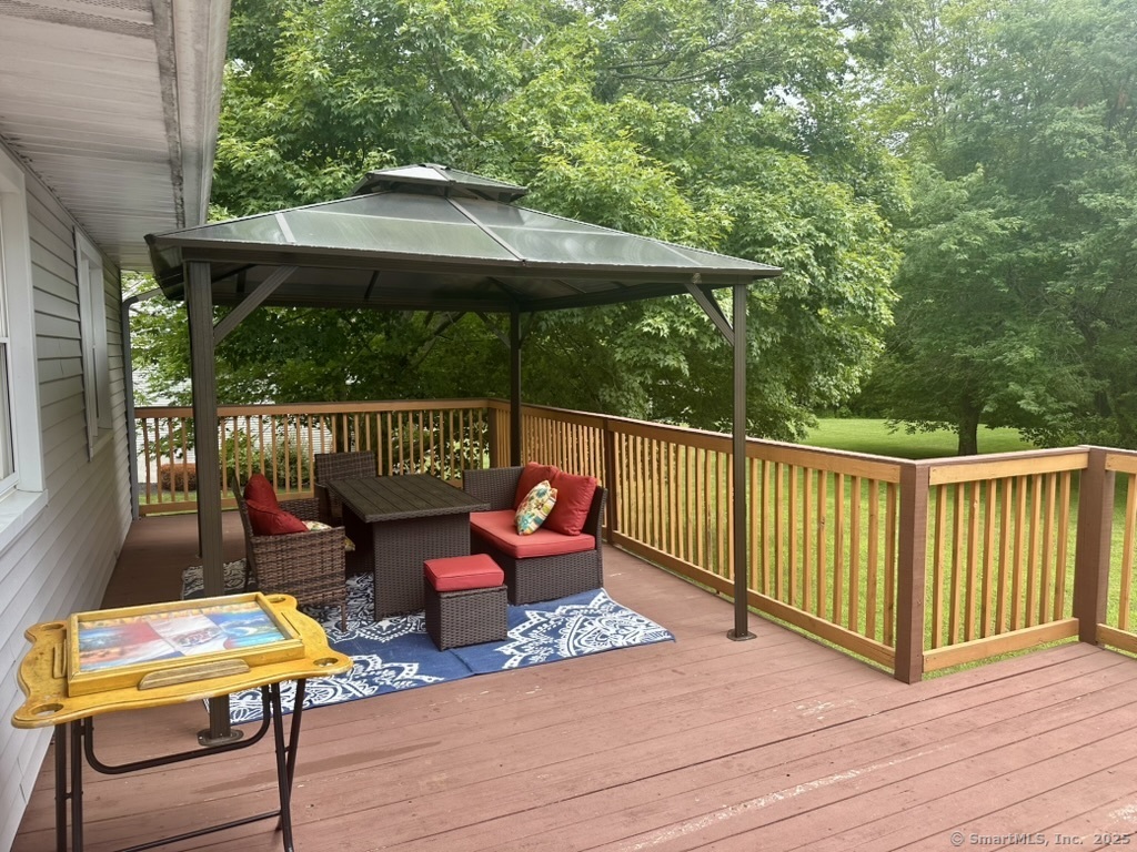 660 East Street South Suffield, CT 06078 - Photo 11 of 39 a backyard of a house with fountain table and chairs
