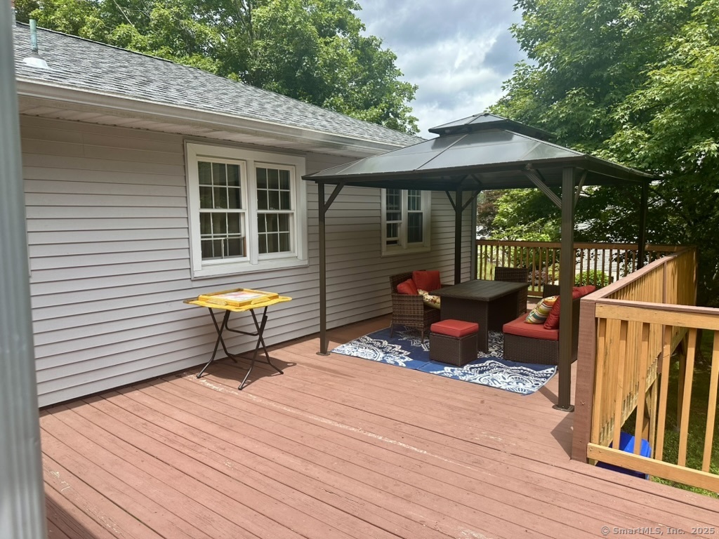 660 East Street South Suffield, CT 06078 - Photo 12 of 39 a view of a deck with wooden floor and outdoor seating