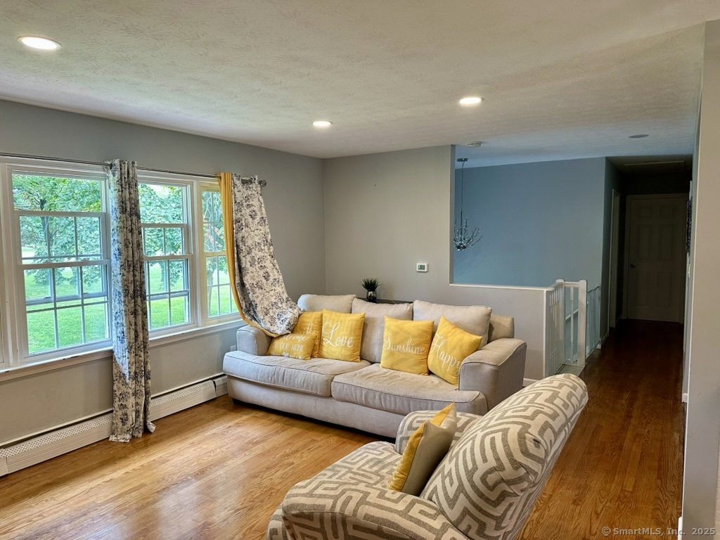 660 East Street South Suffield, CT 06078 - Photo 13 of 39 a living room with furniture and a large window