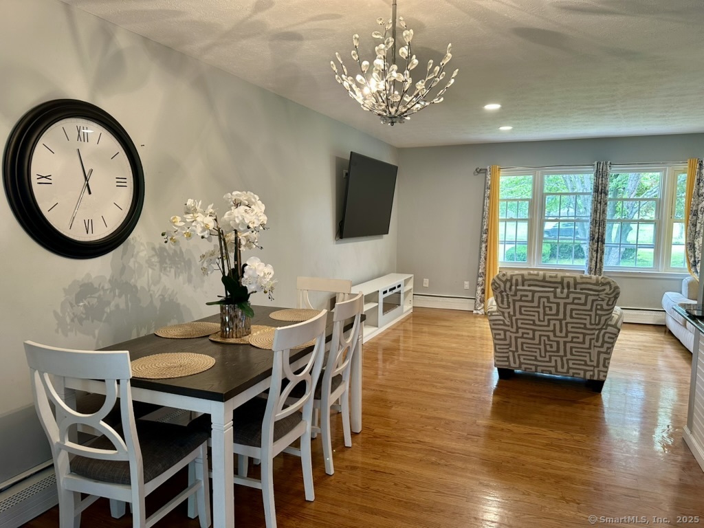 660 East Street South Suffield, CT 06078 - Photo 18 of 39 a view of a dining room with furniture window and wooden floor