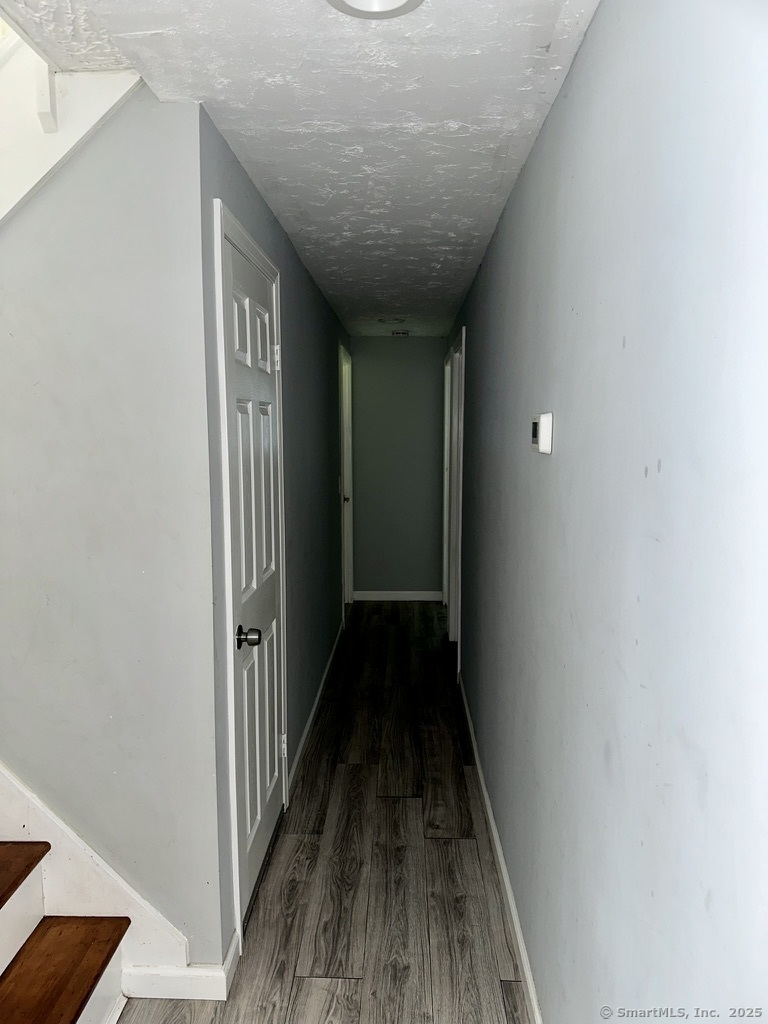 660 East Street South Suffield, CT 06078 - Photo 20 of 39 a view of a hallway with wooden floor