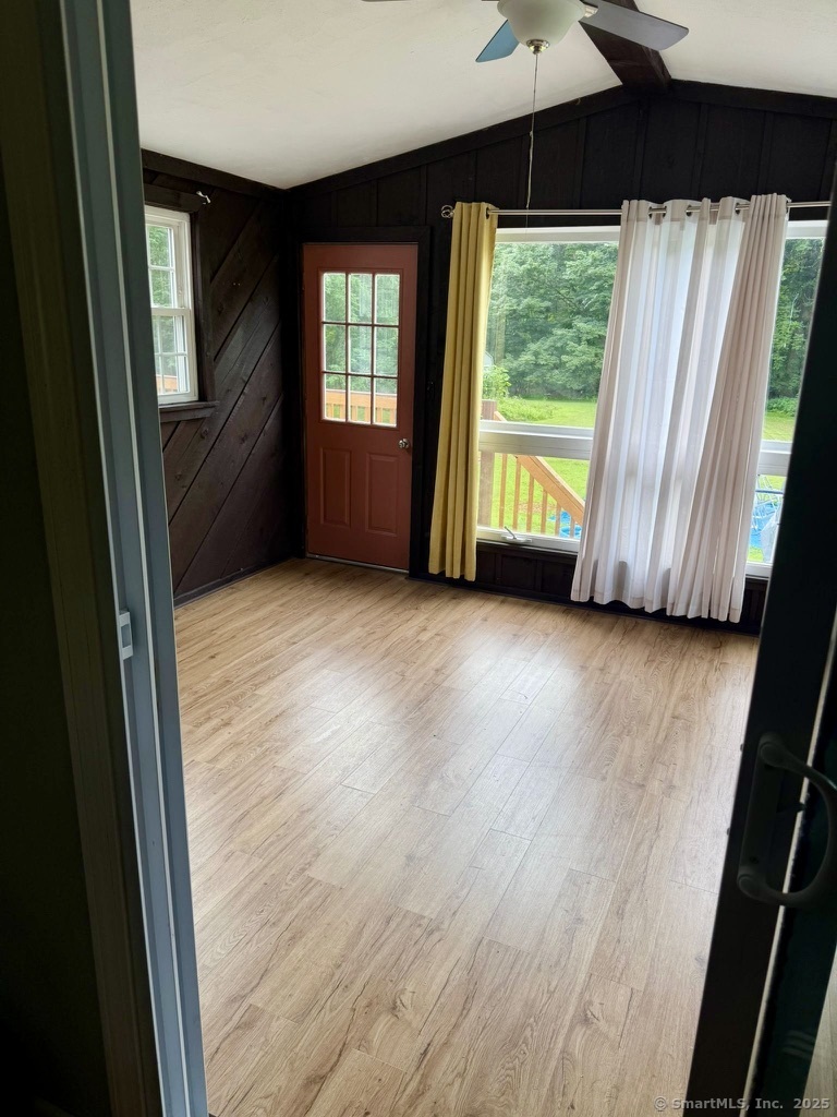 660 East Street South Suffield, CT 06078 - Photo 2 of 39 a view of an empty room with wooden floor and a window
