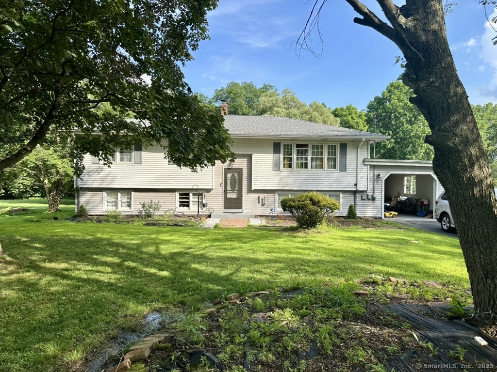 660 East Street South Suffield, CT 06078 - Photo 24 of 39 a front view of a house with yard and green space