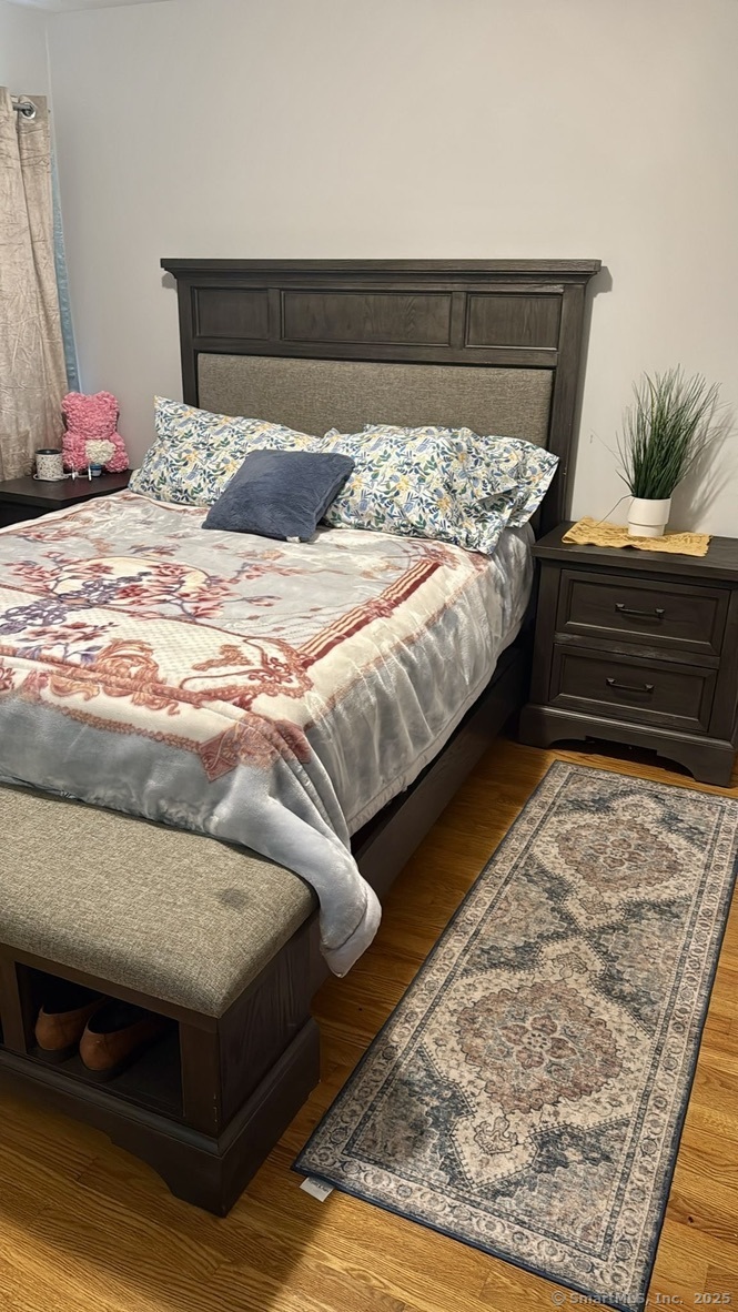 660 East Street South Suffield, CT 06078 - Photo 25 of 39 a bedroom with a bed and a couch