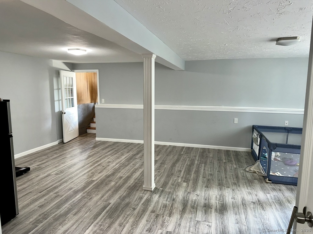 660 East Street South Suffield, CT 06078 - Photo 30 of 39 a view of empty room with wooden floor