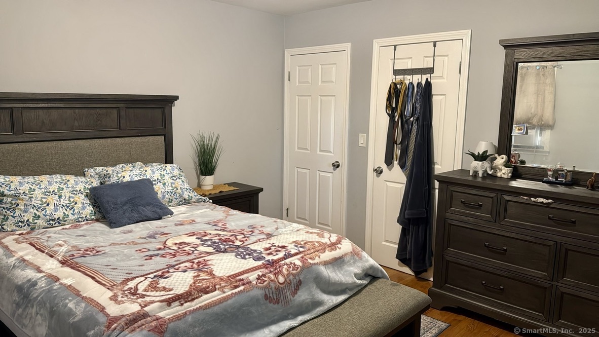 660 East Street South Suffield, CT 06078 - Photo 3 of 39 a bedroom with a bed and a dresser