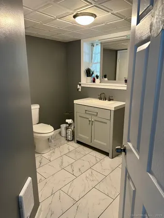 a bedroom with a bed and flat screen tv