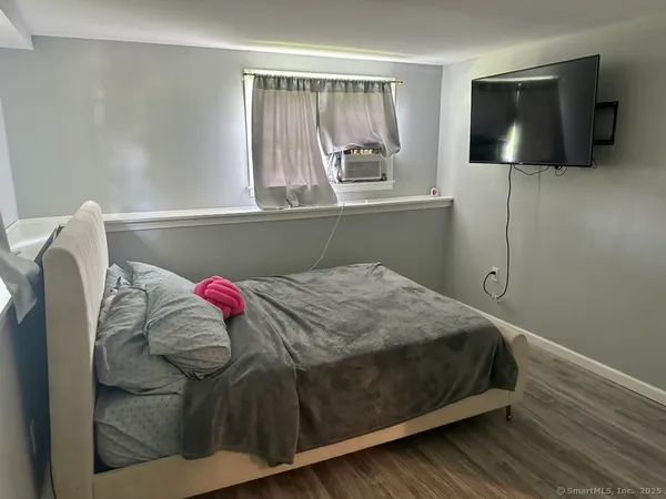 a bedroom with a bed and a closet