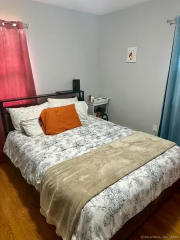 a bedroom with a bed and a closet