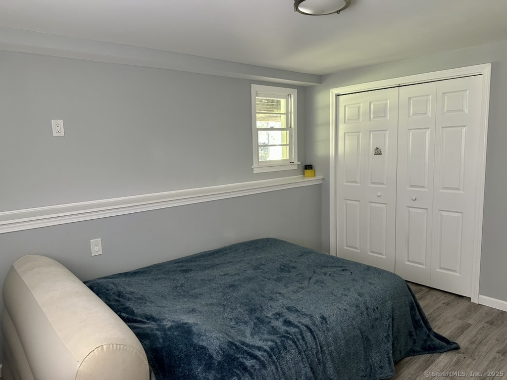 660 East Street South Suffield, CT 06078 - Photo 4 of 39 a bedroom with a bed and a window