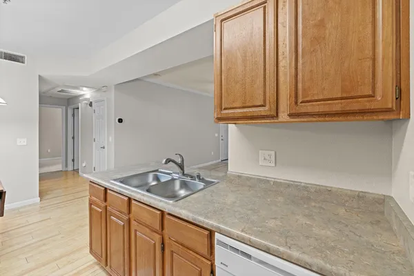 a kitchen with a sink and cabinets