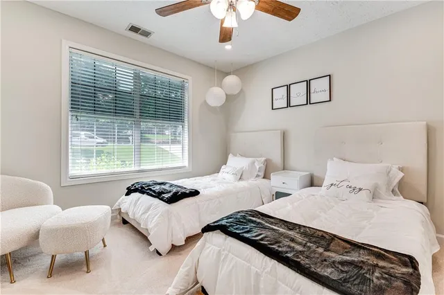 a bedroom with a bed and a television