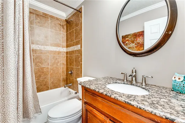 a view of a patio with table and chairs under an umbrella