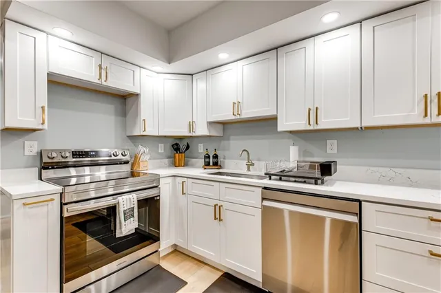 a view of a kitchen with refrigerator and chair