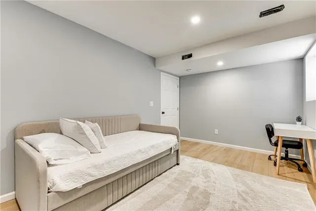 a bed room with a bed and a table