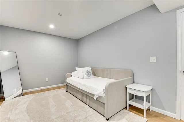 a view of a yard with wooden fence