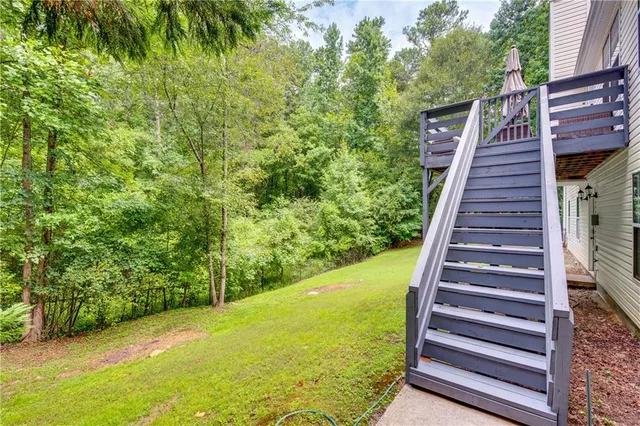 a backyard of a house with lots of green space
