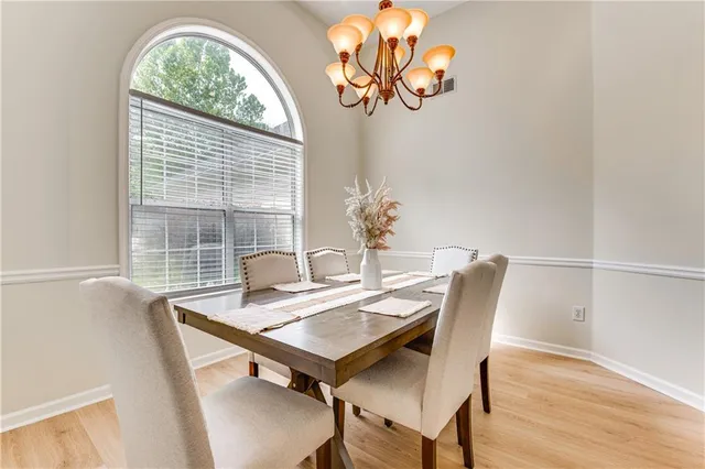 a view of a dining room with furniture window and outside view