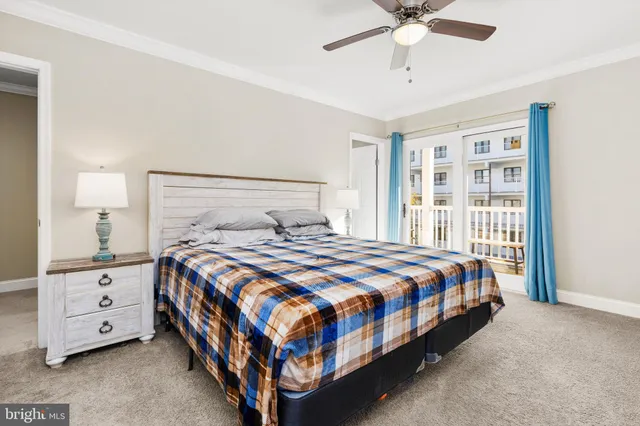 a bedroom with a bed and ceiling fan