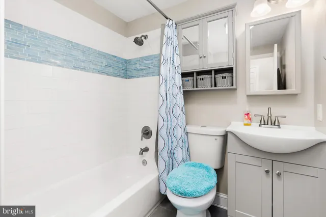 a bedroom with a bed and a table