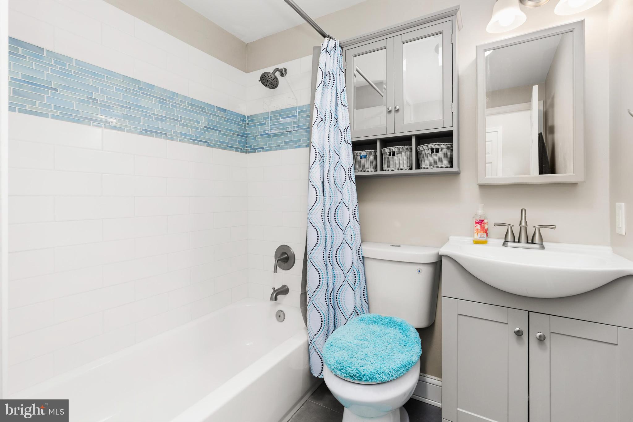 9 64th Street, Unit 304 Ocean City, MD 21842 - Photo 24 of 41 a bathroom with a sink toilet and shower