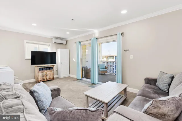 a living room with furniture and a rug