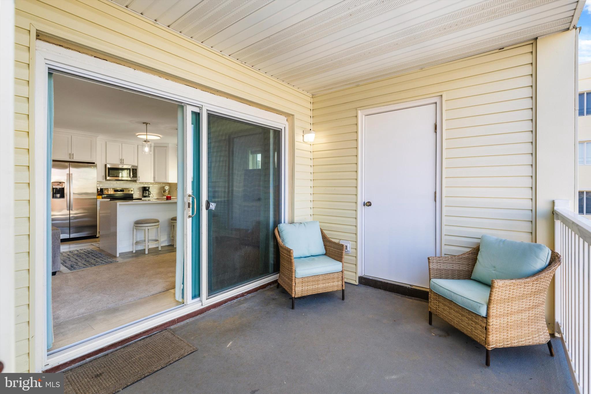 9 64th Street, Unit 304 Ocean City, MD 21842 - Photo 9 of 41 a living room with furniture and a window