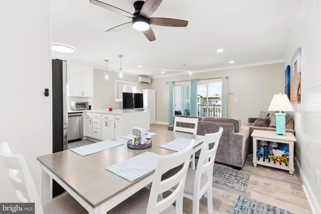 a view of kitchen with refrigerator stove and microwave