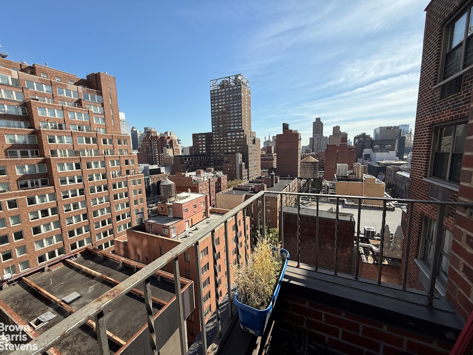 a view of a balcony with wooden benches
