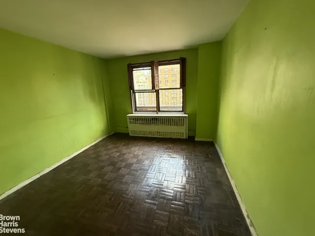 a bedroom with bed and window