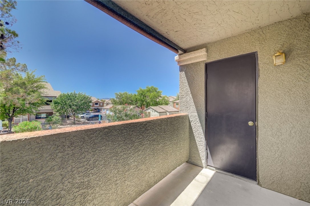 555 East Silverado Ranch Boulevard, Unit 2124 Las Vegas, NV 89183 - Photo 34 of 47 Enjoy views of mature landscaping and the neighborhood from this private balcony.