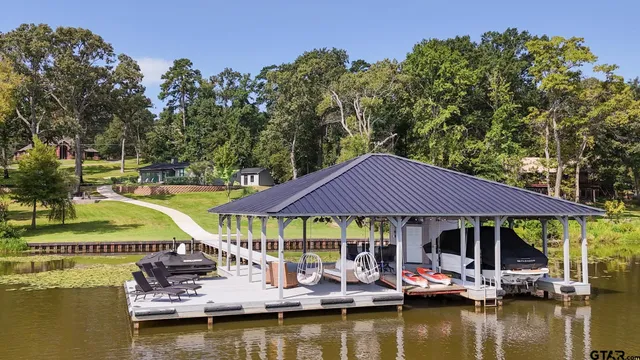 a view of an ocean with tables and chairs