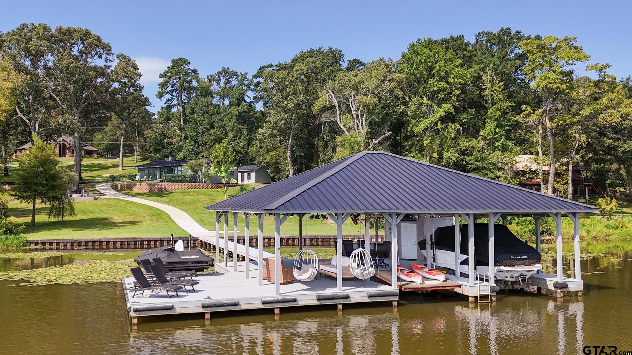 a view of an ocean with tables and chairs
