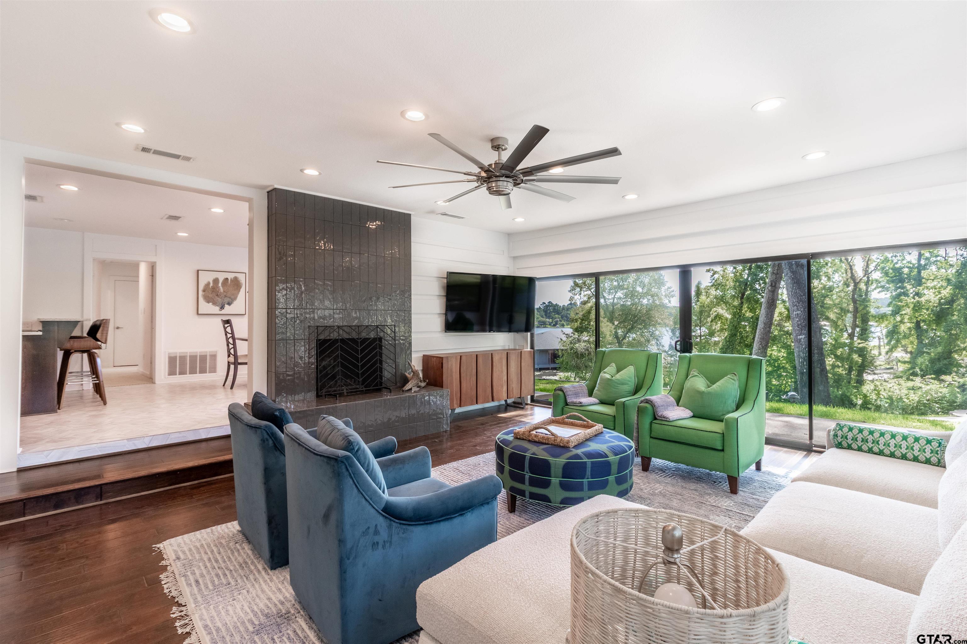 15807 North Peninsula Road Whitehouse, TX 75791 - Photo 11 of 44 a living room with furniture fireplace and a large window
