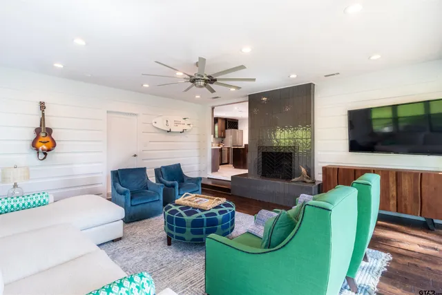 a living room with furniture and a flat screen tv