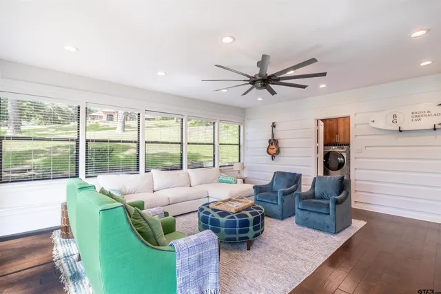 a living room with furniture and a large window