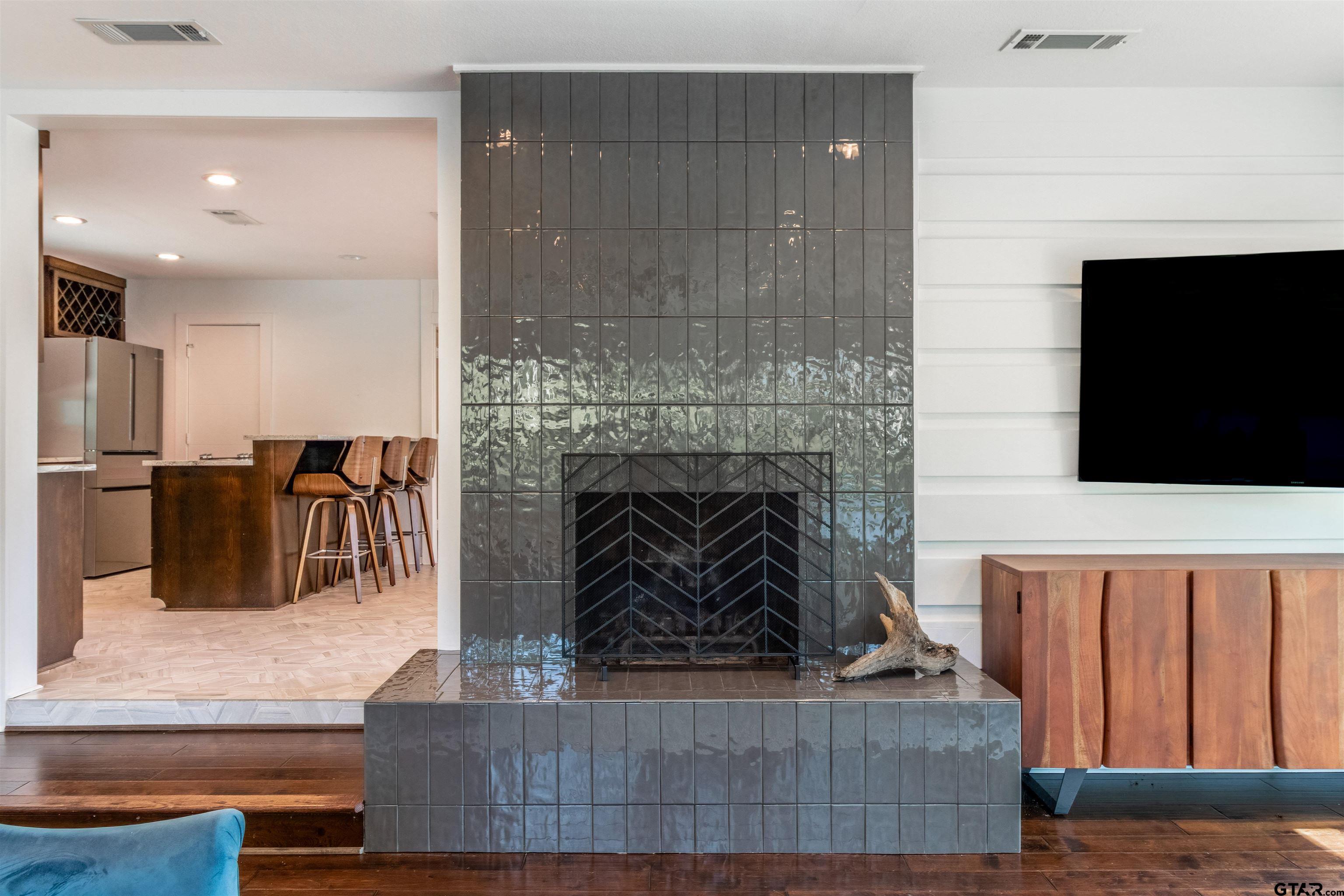 15807 North Peninsula Road Whitehouse, TX 75791 - Photo 14 of 44 a living room with furniture a flat screen tv and a fireplace