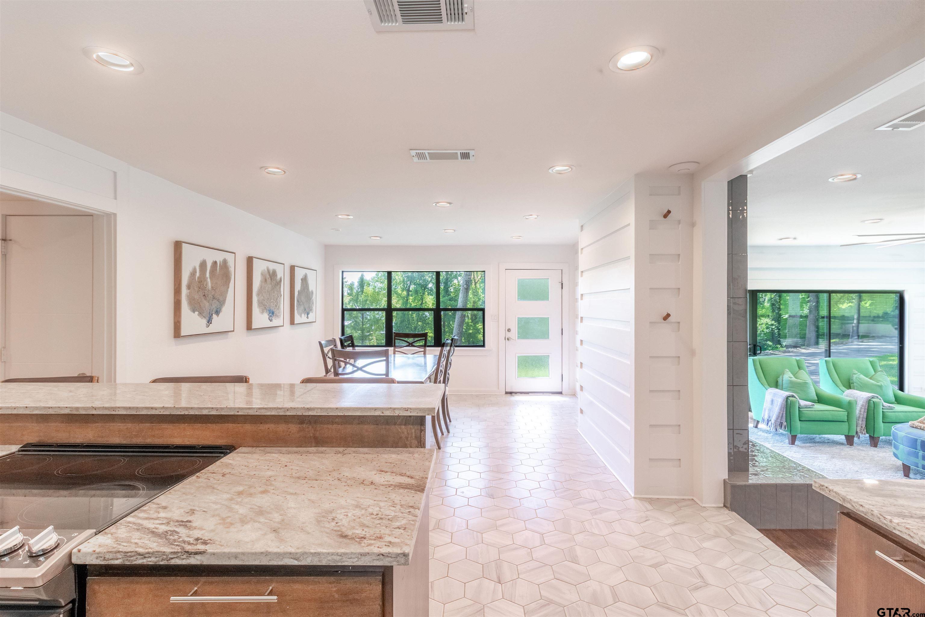 15807 North Peninsula Road Whitehouse, TX 75791 - Photo 20 of 44 a view of a kitchen with a sink and a large window