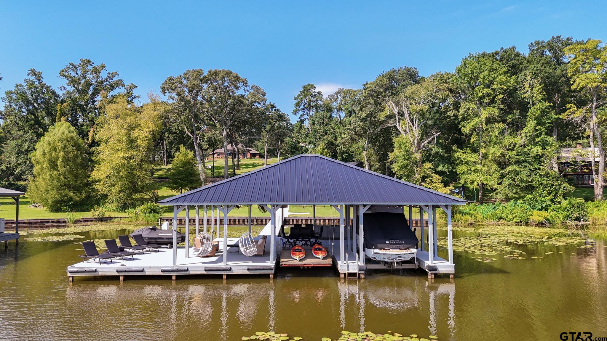 15807 North Peninsula Road Whitehouse, TX 75791 - Photo 2 of 44 a view of house with swimming pool yard and outdoor seating