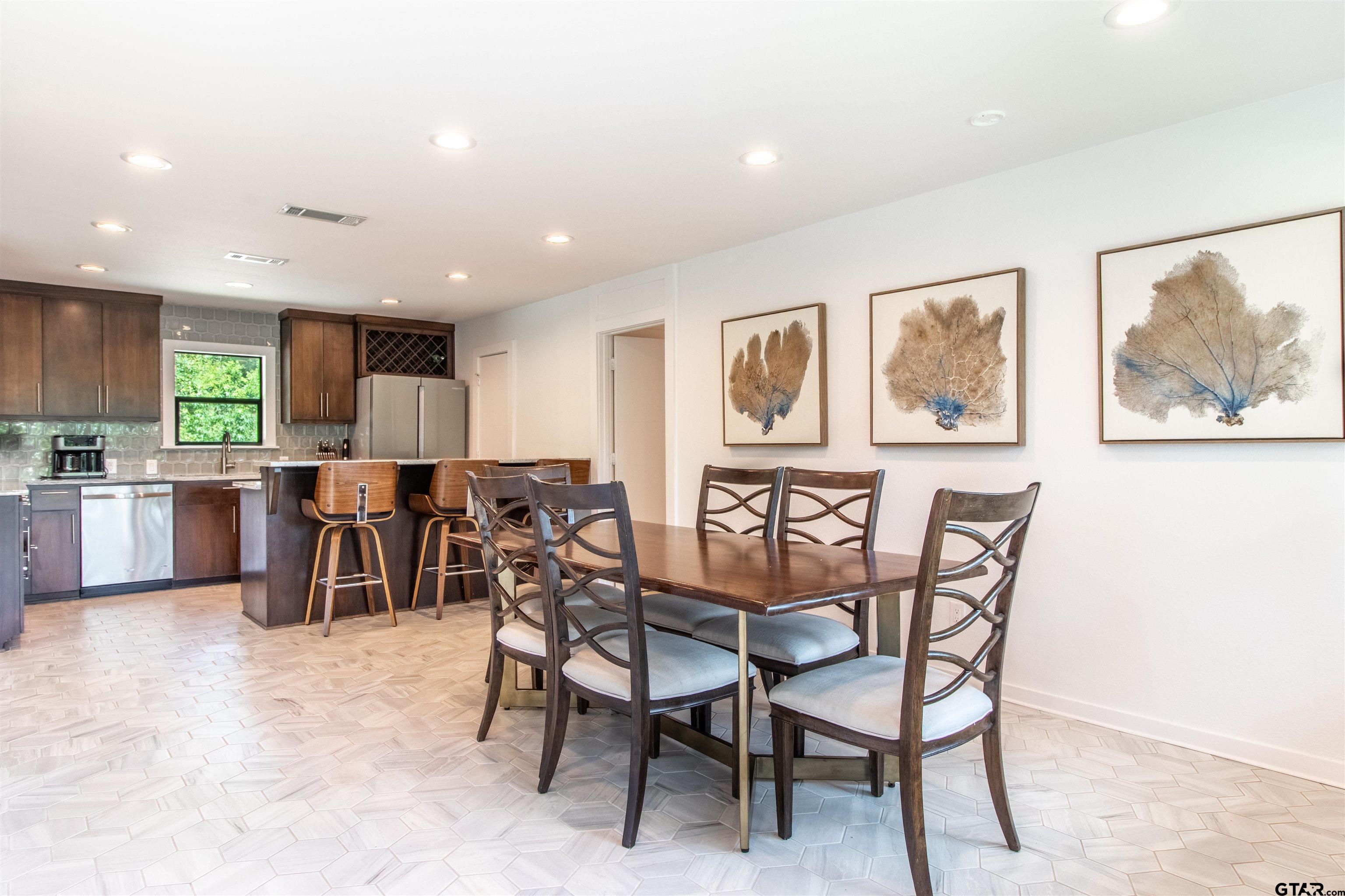 15807 North Peninsula Road Whitehouse, TX 75791 - Photo 22 of 44 a view of a dining room with furniture