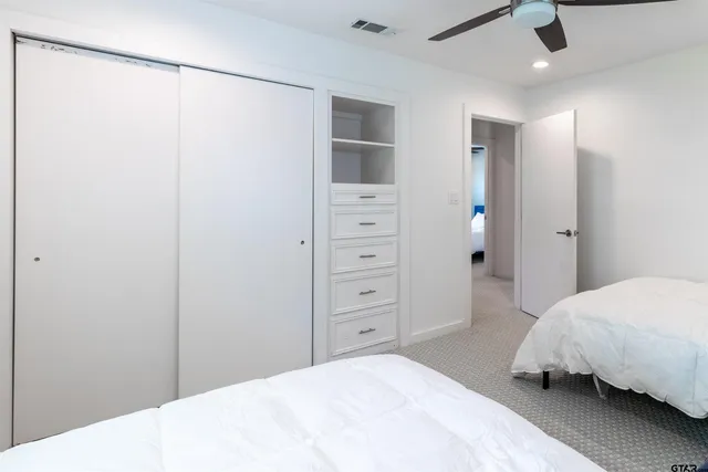 a bedroom with a bed and a walk in closet