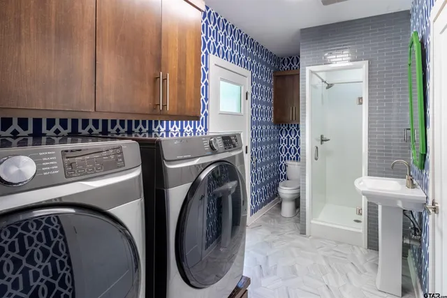 a utility room with dryer and washer