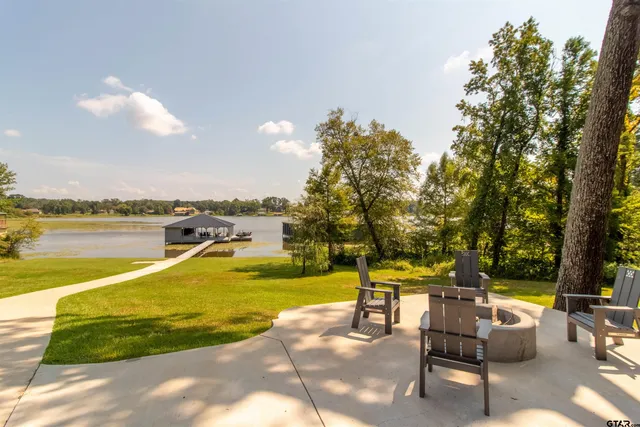 a view of a swimming pool with lounge chairs