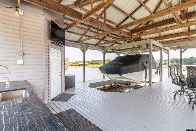 a view of a room with wooden floor and furniture