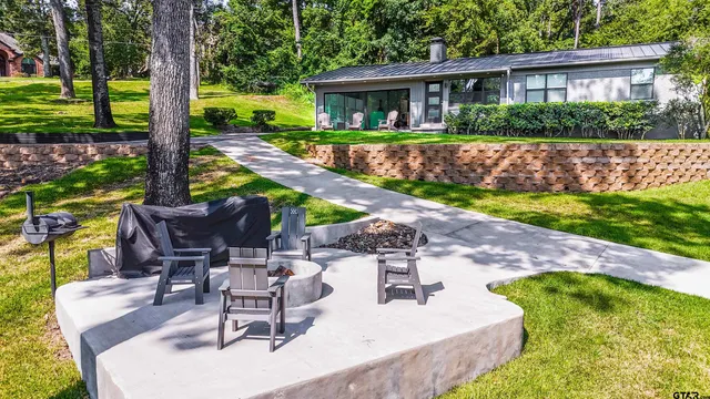 a view of a patio with swimming pool
