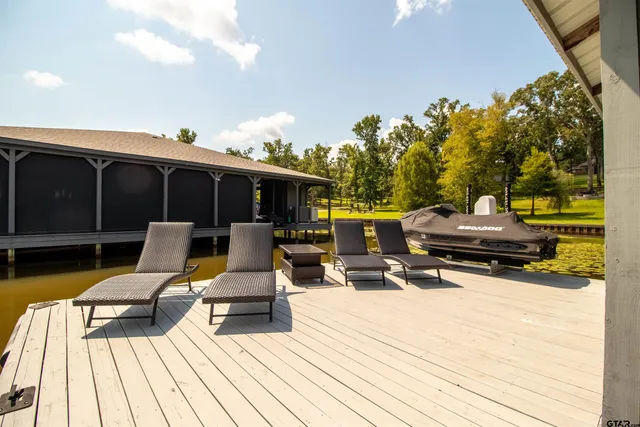 a view of a wooden floor and lake