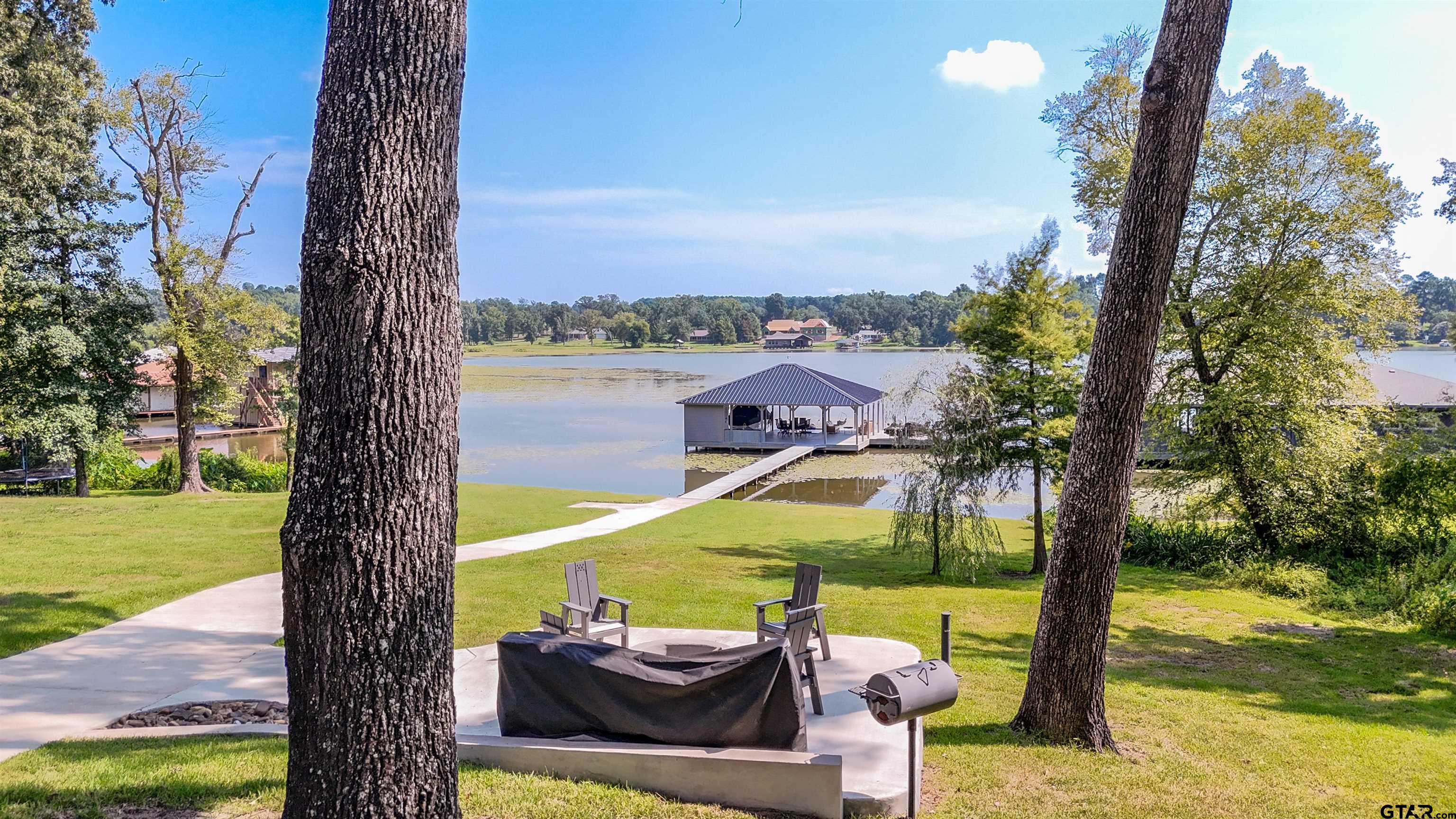 15807 North Peninsula Road Whitehouse, TX 75791 - Photo 9 of 44 a view of swimming pool with a table and chairs