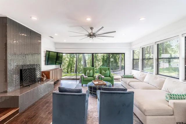 a living room with furniture and a fireplace