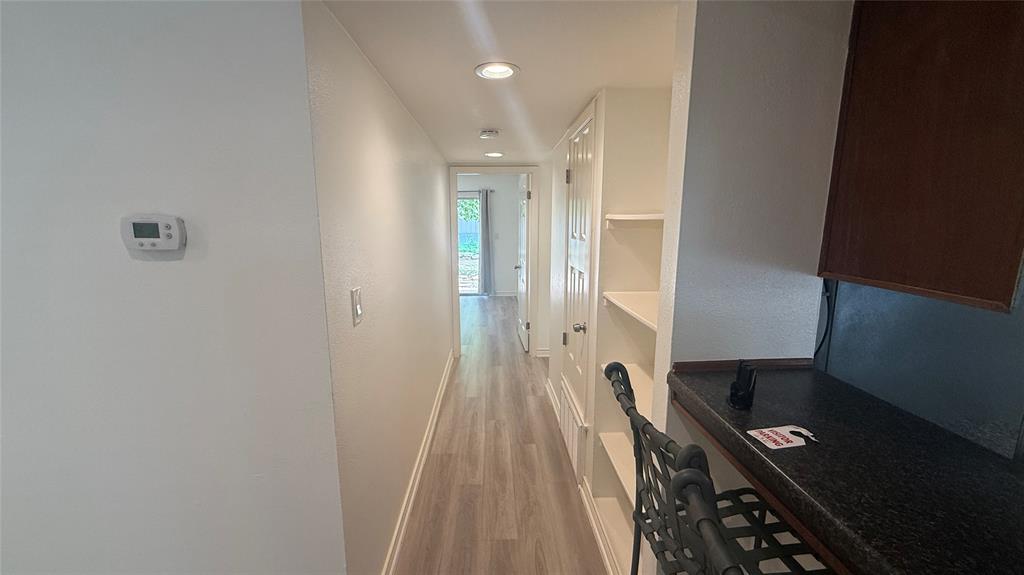 500 East Riverside Drive, Unit 132 Austin, TX 78704 - Photo 8 of 31 a view of a hallway with wooden floor